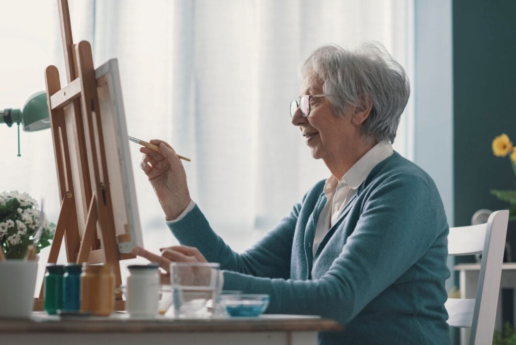 The grieving woman painting on a canvas